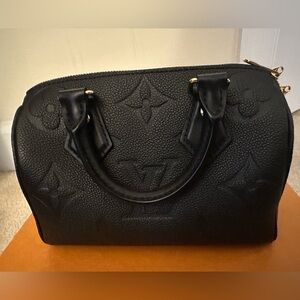 Louis Vuitton monogram empriente leather.